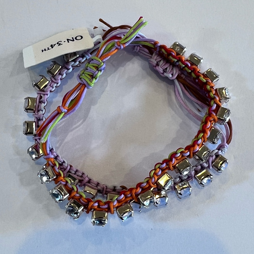 NWT. On 34th Gold Tone 2
Piece Crystal Cord Slider Bracelet Set MSRP $49.